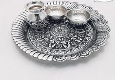 a silver plate with two bowls on it