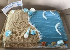 a birthday cake that looks like the beach is made out of frosting and sand