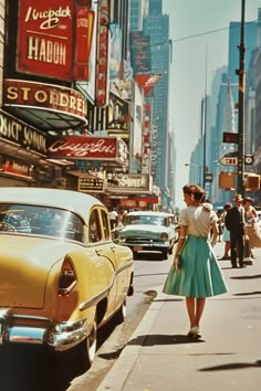 a woman is walking down the street in an old fashion dress and heels with her hand on her hip