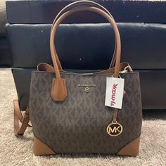 Michael Kors Handbag Nwt Comes With Long Strap And Can Be Used As A Shoulder Bag Has Mk Logo On Bag Michael Kors Tote Satchel For On-the-go, Medium Travel Bag With Gold-tone Hardware, Medium Shopping Bags With Detachable Strap, Michael Kors Coated Canvas Shopping Bags, Michael Kors Satchel Shoulder Bag For Shopping, Michael Kors Bag With Top Carry Handle For On-the-go, Michael Kors Double Handle Bags For On-the-go, Michael Kors Shoulder Bag With Top Handle, Michael Kors Top Handle Bag For On-the-go