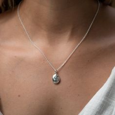 Metal: Recycled 925 Sterling Silver Dimensions: Locket 15x11x5mm, hinged clasp, photo insert 10x6mm Chain: Belcher Chain Standard 40-45cm (16"-18") Long Length 61cm (24") Matching Jewellery Available: See Full Locket Collection Packaging Options: Minimal, Standard or Gift Packaging, available at checkout PLEASE NOTE WE ARE UNABLE TO RESIZE AND INSERT PHOTOS INTO OUR LOCKETS A true classic this tiny celestial locket adds understated elegance to your jewellery collection. A pleasingly smooth oval Dainty Silver Locket, Silver Necklace With Pendant, Silver Locket Aesthetic, Dainty Silver Jewellery, Necklace Inspo Silver, Lockets Silver, Simple Locket, Unique Locket Necklace, Locket Necklace Silver