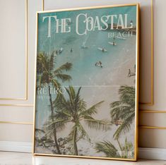 a poster on the wall with people surfing in the ocean and palm trees surrounding it