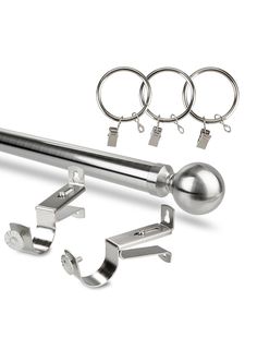 an assortment of metal objects including balls, hooks and eyeballs on a white background