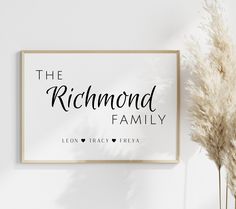 the richmond family sign is next to some pamyllica in front of a white wall