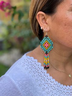 These earrings are part of the art and traditions of the highland Mayan communities in Chiapas, Mexico. These earrings look great for any age and for any occasion. Your purchase is will help the indigenous artisans of Chiapas. The earrings are lightweight and add a pop of color to any outfit. Easy to wear from day and transition into night. We love how fun these are. Closure: Ear Wire Material: Beads, synthetic thread, and stainless steel ear threaders Made in Mexico Multicolor Fair Trade Beaded Earrings For Festival, Fair Trade Multicolor Beaded Earrings For Festival, Adjustable Multicolor Fair Trade Earrings, Traditional Turquoise Beaded Earrings, Traditional Beaded Earrings With Round Beads, Traditional Round Bead Earrings For Festivals, Traditional Turquoise Beaded Earrings As Gift, Traditional Turquoise Handwoven Jewelry, Traditional Turquoise Beaded Earrings For Festivals