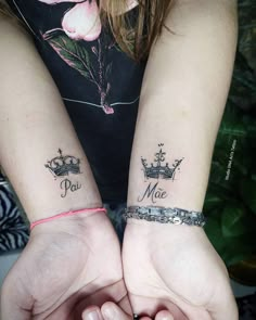 two people with matching tattoos on their arms