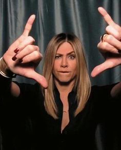 an image of a woman holding up two fingers