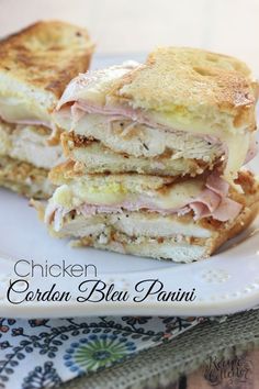 a sandwich cut in half on a plate with the words chicken, garden bleu panini