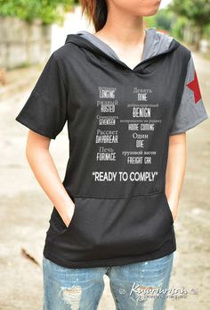 a woman wearing a hoodie with words on it