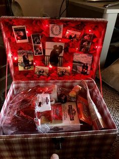 an open suitcase with pictures and lights in it