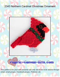 a crocheted christmas ornament with a red bird on it's back