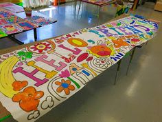 a long bench covered in lots of colorful letters