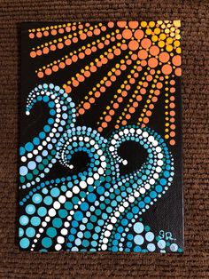 an octopus painting on a black canvas with orange and blue dots in the background,