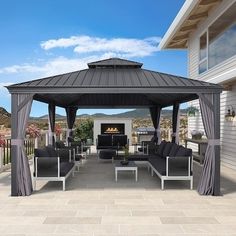 an outdoor living area with furniture and a fire place