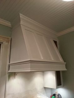 a white stove top oven sitting inside of a kitchen