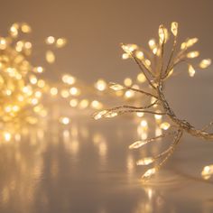 a bunch of lights that are on a white counter top with some blurry lights in the background