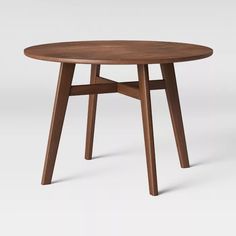 a round wooden table with two legs on the top and one leg extended to the side