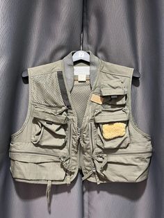 90s Columbia Fishing Vest. Conditions...as is...very good vintage/ preowned conditions. Please check all pictures provided carefully. Please check your measurements as tags size not run consistently across country/vintage items  Measurements: (inches) Approx. +-  A: 20 B: 17.5 C: 16.5 D: - All measurements taken when garments laid flat. All sales are final. No Return No Refund. Most of our sales items have been used, therefore tiny flaws due to the effect of wear is common. All items have thorou Fishing Vest Pattern, Khaki Hunting Vest With Pockets, Military Cotton Vest With Cargo Pockets, Military Vest With Pockets For Hunting, Fishing Vest, Mens Vests, Vintage Country, Vest Outfits, Columbia