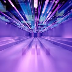 an abstract image of purple lights in a room