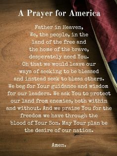 an american flag with a poem written in it on top of a wooden table next to a red, white and blue blanket