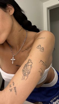 a woman with a cross on her arm