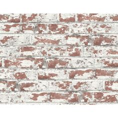 an old brick wall with white and red paint