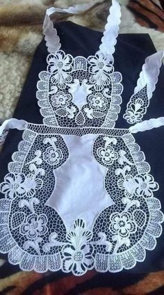 a black bag with white lace on it