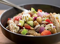 a bowl filled with vegetables and chickpeas