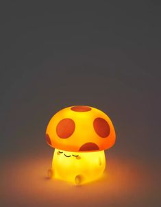 a mushroom shaped light sitting on top of a table