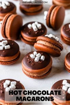 chocolate macaroons with marshmallows on top and the words hot chocolate macarons above them