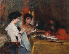 two women sitting at a table with books and papers in front of them, one reading