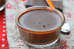 there is a chocolate dessert in a glass on the table