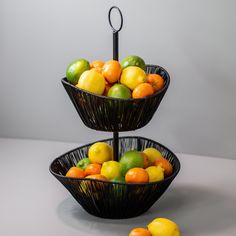 three tiered trays holding different types of fruit