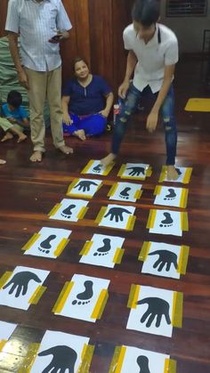 children are playing with handprints on the floor