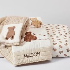 two baby blankets with teddy bears on them and the name mason printed on one blanket