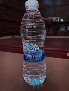 a bottle of water sitting on top of a table