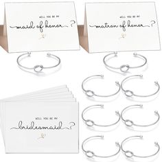 the bridesmaid gift set includes bracelets, note cards, and envelopes