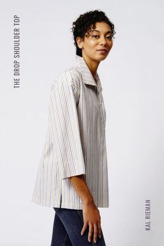 Attitude is everything in our Drop Shoulder Stripe Tunic. With an exaggerated wing collar, drop shoulder fit, and slightly wider sleeve, wear all of the colors of the season in our multi stripe 100% European cotton shirt. Pairs great with denim or any navy trouser for the office too! Our summer 2023 fashion collection is available now. Classy Spring Outfits, Spring Workwear, Bracelet Sleeve, Drop Shoulder Top