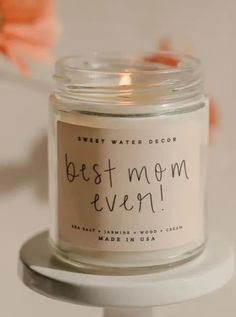 a candle that says best mom ever on it