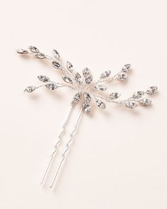 JENNA CRYSTAL HAIR PIN (TP-2844) Romantic & perfectly delicate, Jenna is hand wired with flexible branches of our highest grade of crystals that glisten from every angle. DETAILS * Crafted with our highest grade of crystals. These crystals have * more facets for show stopping brilliance. The difference is visible. * Hair pins sold individually or in a set of 2. * Measures 3.5 x 3 inches. * Finish: silver. * Versatile & flexible, this hair pin can be styled as a single pin or in multiples. The ha Wedding Hair Diamante Pins, Wedding Hair Rhinestone Pins, Wedding Hair Jewelry Brides & Hairpins, Cheap Elegant Silver Pins, Luxury Silver Pins For Formal Events, Bride Hair Jewelry Brides & Hairpins, Diamante Hair Pins, Elegant Silver Pins, Affordable, Bling Wedding Theme