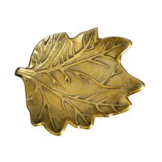 a gold leaf shaped object on a white background