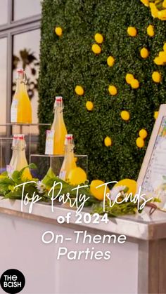 a table with lemons and bottles on it, next to a sign that says top party friends of 2012