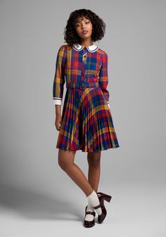 Full of vibrant primary colors in rich crayon box hues, this playful plaid dress from our ModCloth namesake label has endless styling possibilities. Made from a cotton-blend weave, this retro-inspired dress boasts a contrasting white, Peter Pan collar and button-closure cuffs trimmed in navy blue ric-rac detailing ! Featuring button-up closure at the bodice, and a high-rise waistline with a removable and matching belt that leads to a micro-pleated, knee-length skirt complete with handy side pock Quirky Fashion Vintage, Retro Photoshoot, Retro Inspired Dress, Statement Outfit, Color Combinations For Clothes, Valentines Day Dresses, Crayon Box, Curated Closet, Mod Cloth Dresses