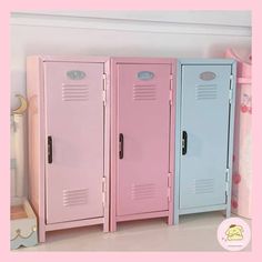 three pink and blue lockers sitting next to each other on a shelf in a child's room