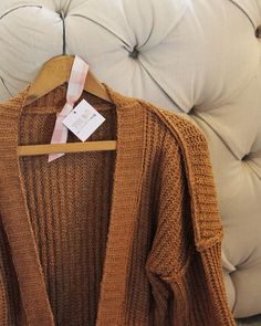 We love this cozy sweater. The absolute softest nubby knit pairs with an open front, slouchy sleeves & cozy front pockets. Slouchy fit & cute nubby seams. Perfect layered with a tee & denim. Color: Timber Poly Hand wash cold Small Medium Large Bust 42 44 46 Waist 42 45 46 Hips 43 46 47 Length 30 30 30 Bust, waist, and hip measurements are a total circumference. Length is measured from the top of the sweater to the hem. Measurements are an estimate. Cozy Snug Sweater For Spring, Fall Open Knit Sweater For Loungewear, Everyday Chunky Knit Sweater For Fall, Brown Soft Knit Outerwear With Relaxed Fit, Fall Lounge Knit Sweater, Snug Trendy Sweater For Fall, Trendy Snug Sweater For Fall, Chunky Knit Sweater For Everyday Fall Wear, Comfortable Chunky Knit Sweater For Loungewear