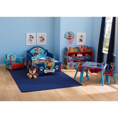 a child's bedroom with blue walls and wooden flooring, including a toy bed