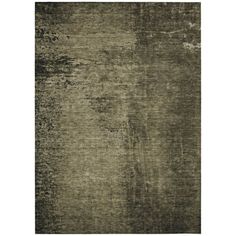 an area rug with dark green tones