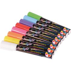 six different colored markers are lined up in a row on a white background with the words midnight