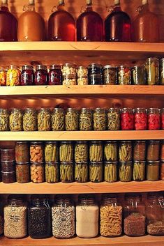 shelves filled with lots of different kinds of jars