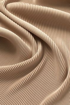 an image of a textured fabric that looks like pleated cloth or something else